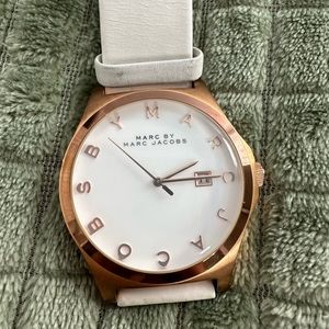 Marc by Marc Jacobs rose gold watch with white leather band.